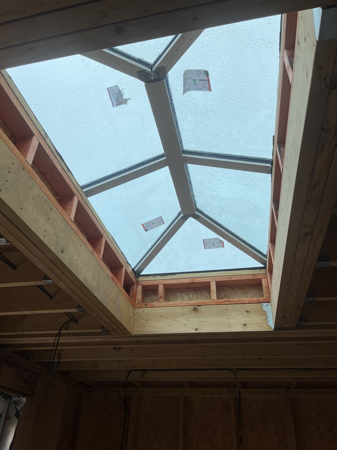 Roof lantern installed within the timber roof structure.