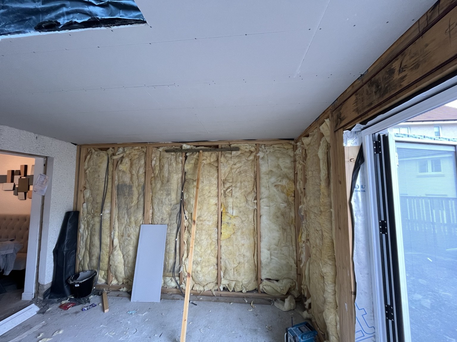 Wall insulation fitted and ceiling plasterboarding underway.